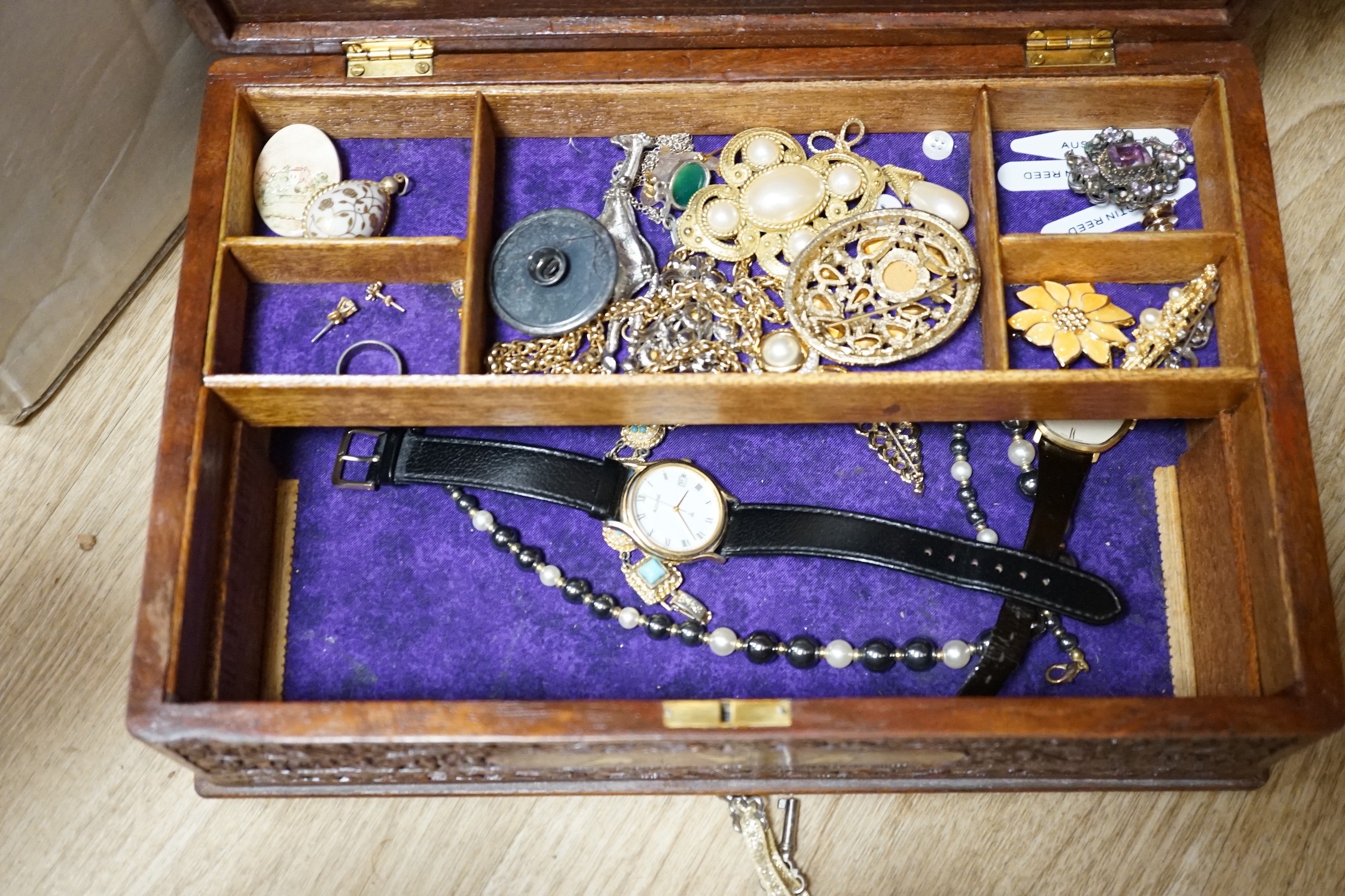 Assorted costume jewellery and wrist watches.